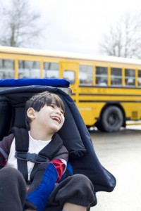 cp kid in wheelchair with bus